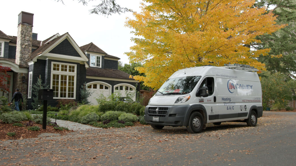 Calvey Heating & Air van by a house Calvey Heating & Air van by a house